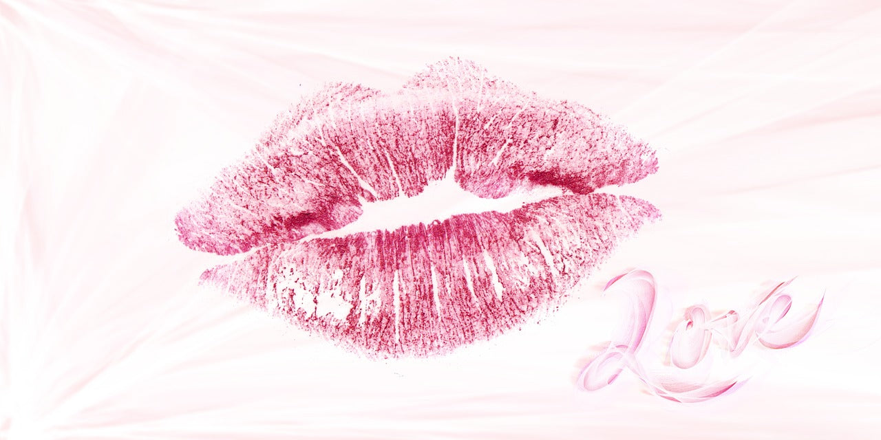 Impression of lipstick-coated pursed lips with 'love' text below