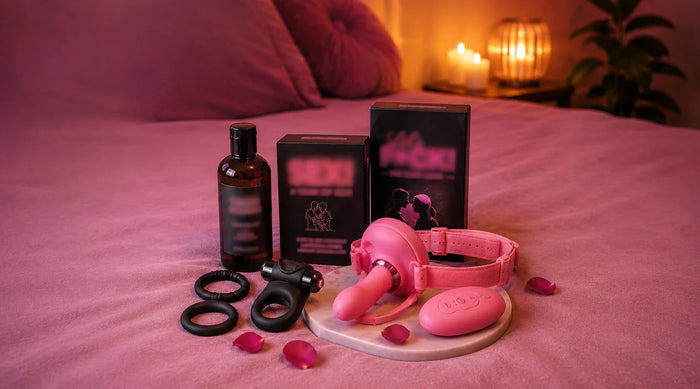 collection of sex toys on a bed