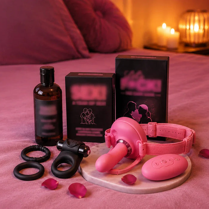 collection of sex toys on a bed