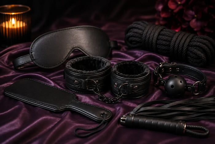 Beginner-friendly BDSM accessories including restraints, blindfold, paddle and ball gag arranged for a guide to bondage and kink in Australia.