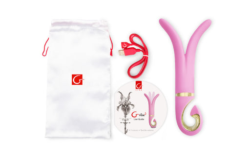 Gvibe 3 candy pink vibrator shown with its included accessories