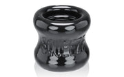 Front view of the OxBalls SQUEEZE Night Edition ball stretcher showing the hourglass profile.