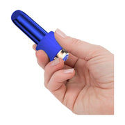 A close-up image of a blue rechargeable bullet vibrator with a silicone comfort cuff, being held in a hand.