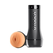 An automatic masturbator with a black cylindrical casing and a flesh-colored penis sleeve. The casing has a touchscreen on the top and the sleeve features a realistic design with a drainage hole at the bottom.