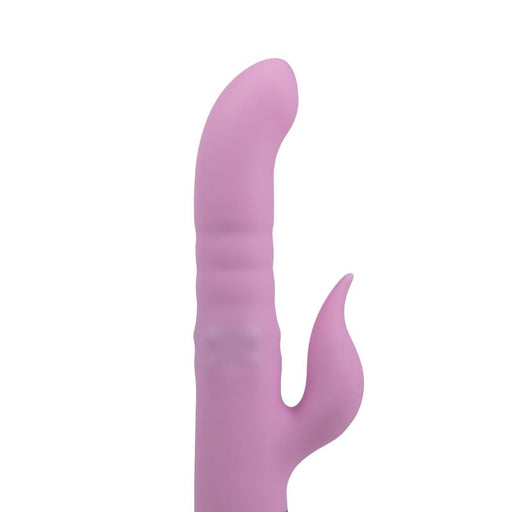 A purple rabbit vibrator displayed in its packaging, which includes a feature description and an interactive LCD display. The product appears sleek and sophisticated with a curved design.