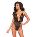 Woman wearing a black lingerie set against a white background
