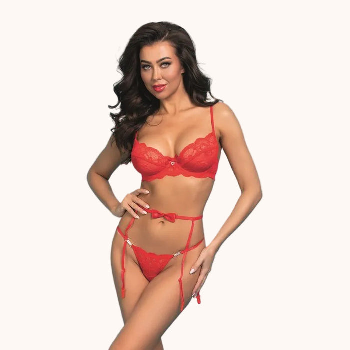 Woman wearing a red lingerie set against a white background