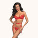 Woman wearing a red lingerie set against a white background