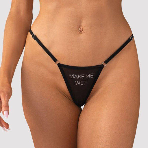 Black thong with 'MAKE ME WET' text on a plain background
