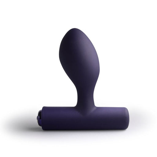 Purple silicone butt plug on a white background