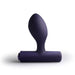 Purple silicone butt plug on a white background