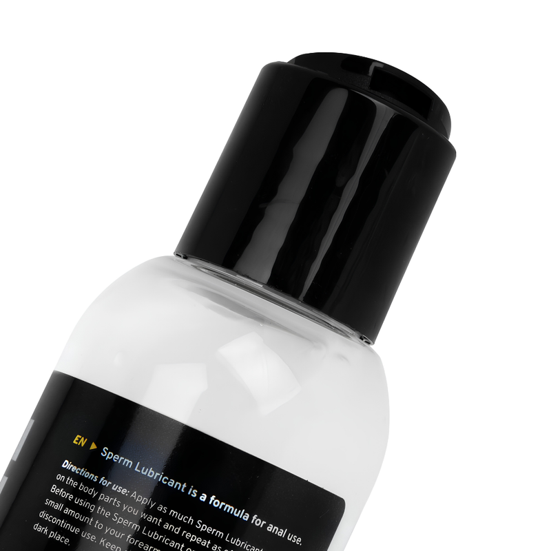 Close-up view of the BUTTR White Cum Lubricant bottle with black cap