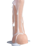 Demonstration of white filling liquid being dispensed into a compatible squirting dildo