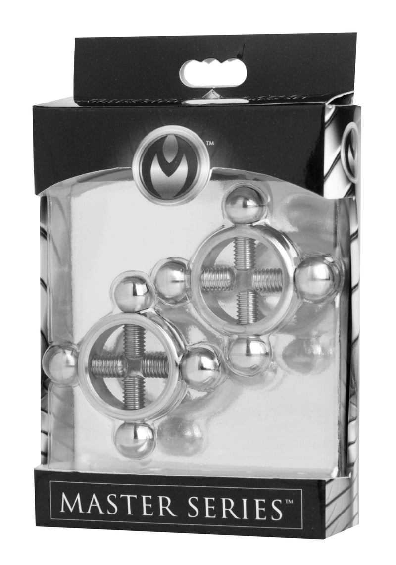 A set of stainless steel nipple presses in a clear package, showing the heavy metal construction with intricate designs.